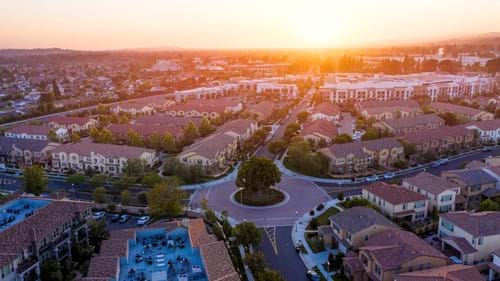 Research different neighborhoods in Orange County that fit your criteria