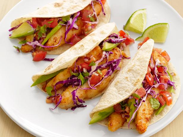 A photo of three delicious looking fish taco