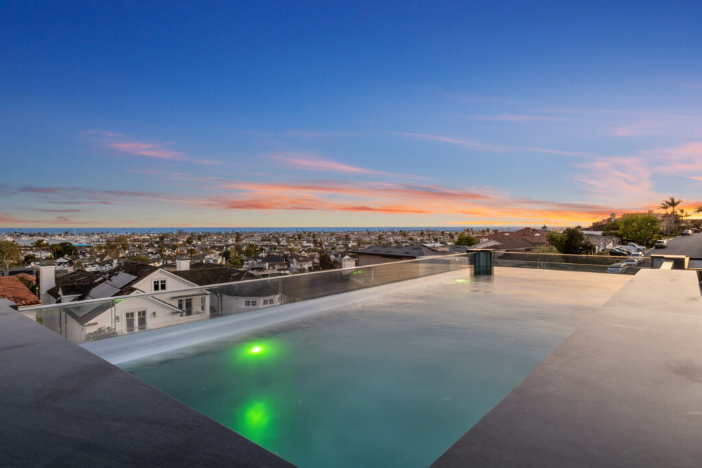 Rooftop infinity pool with ocean views at a luxury home in Newport Beach