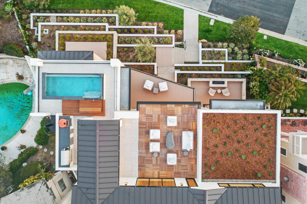 Aerial view of luxury backyard and pool at 302 Kings Rd in Newport Beach