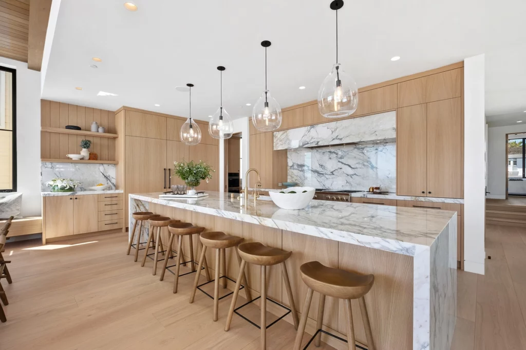 Kitchen of contemporary luxury home with large marble island