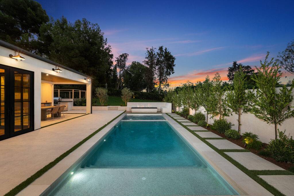 Backyard pool, patio, and sunset views enhance your home value in Corona del Mar