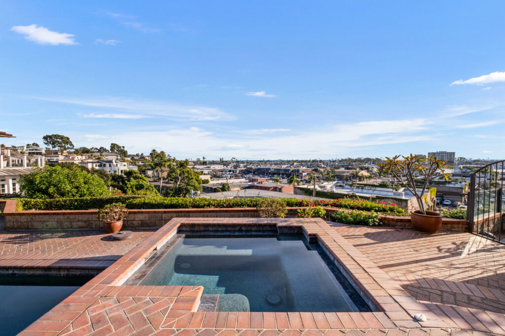 Backyard pool overlooking Newport Beach from above in local luxury real estate listing photos