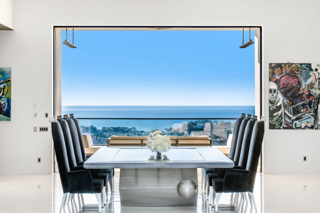 Dining room looking out to big ocean views from property sold by Andy Stavros best luxury listing agent in OC
