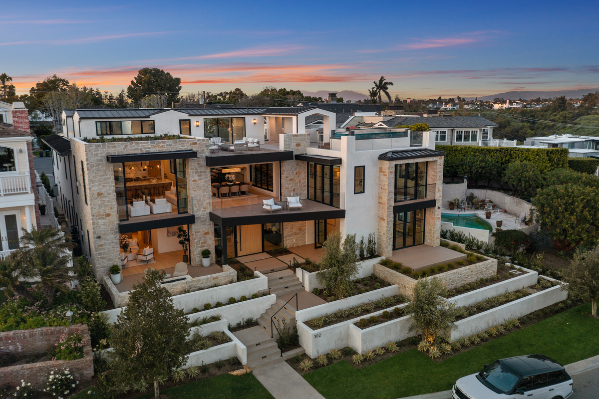 Luxury home front yard with terraced landscaping that sells Orange County real estate for more money