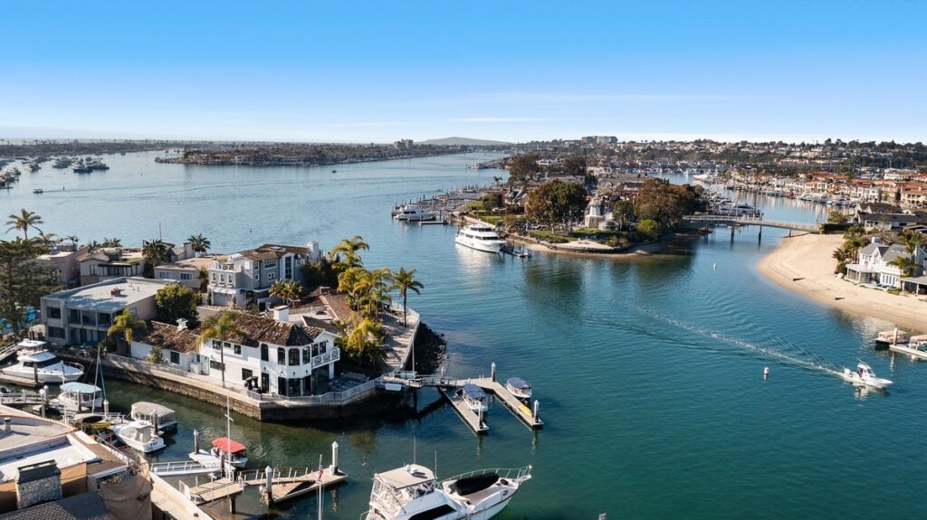 Aerial view of Collins Island and Harbor Island, two locations known for bayfront luxury properties in Newport Beach, CA