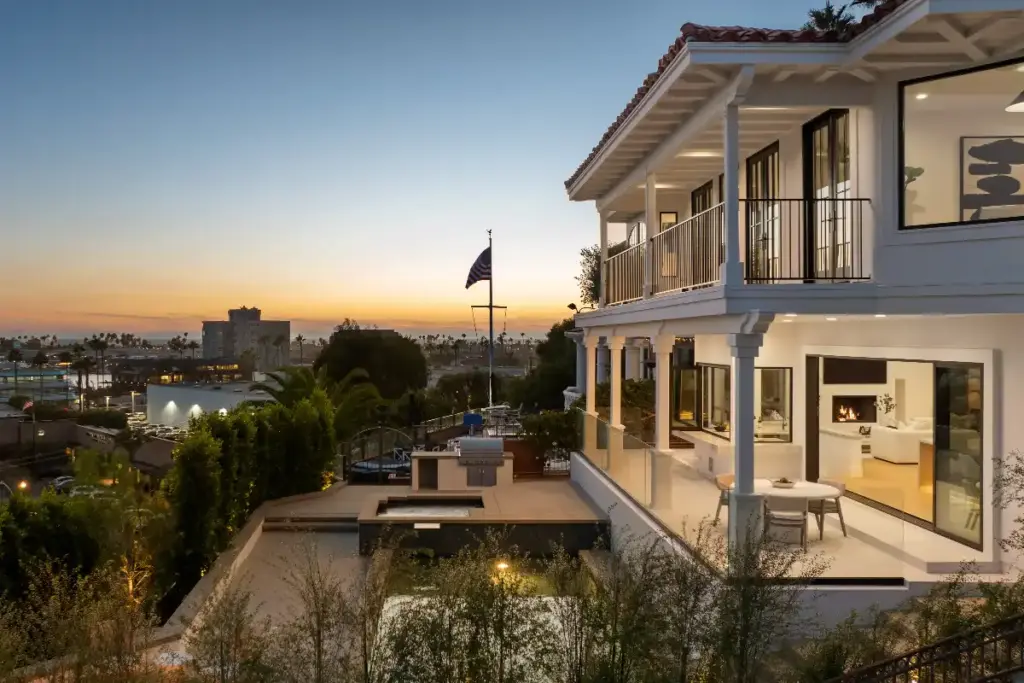Rear exterior of Newport Beach luxury property with outdoor living areas, well prepared with staging and marketing before you sell for the best possible results and fastest sale time.