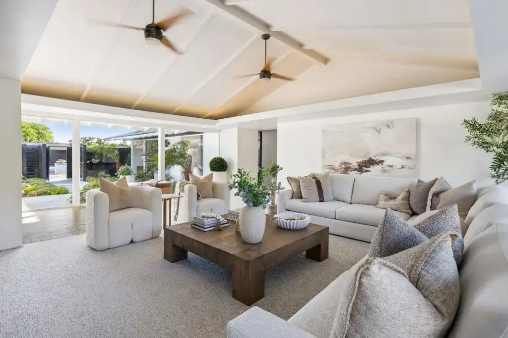 Luxury home interior living room with vaulted ceilings at a listing sold by top listing agent Andy Stavros
