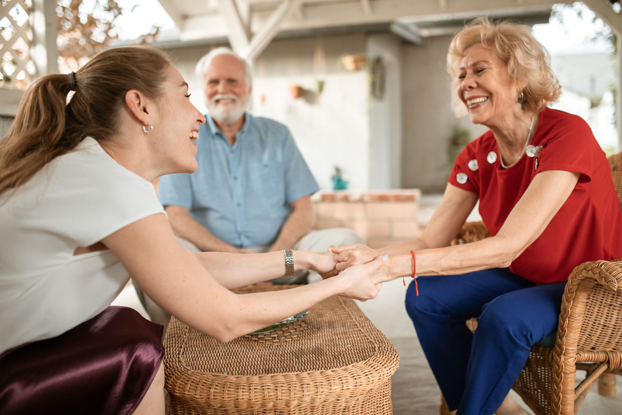 Senior age parents and their happy daughter after buying real estate for family and investing in Orange County property for your adult children and kids